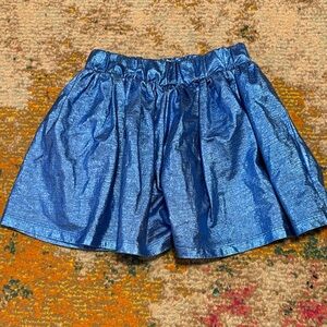 Finger in the nose metallic girls skirt
